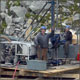 Drillers on a steep slope core drilling rig